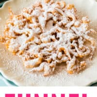 funnel cake topped with powdered sugar on a plate with recipe name at the bottom