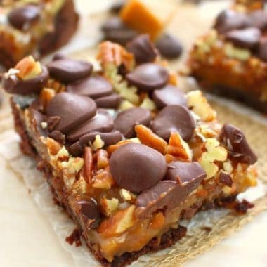 If you love caramel, pecans, coconut, and chocolate then these German Chocolate Cookie Bars are right up your alley! Made with a simple cake mix crust, and topped with all the goodies, these easy cookie bars are perfect anytime you're in the mood for a decadent sweet treat!