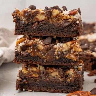 square image of three german chocolate cookie bars stacked up