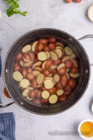 baby potatoes cut into bite-size pieces in a large pot of water