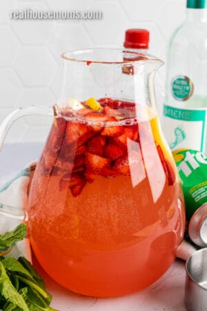 pitcher of giggle juice with strawberries and lemon slices