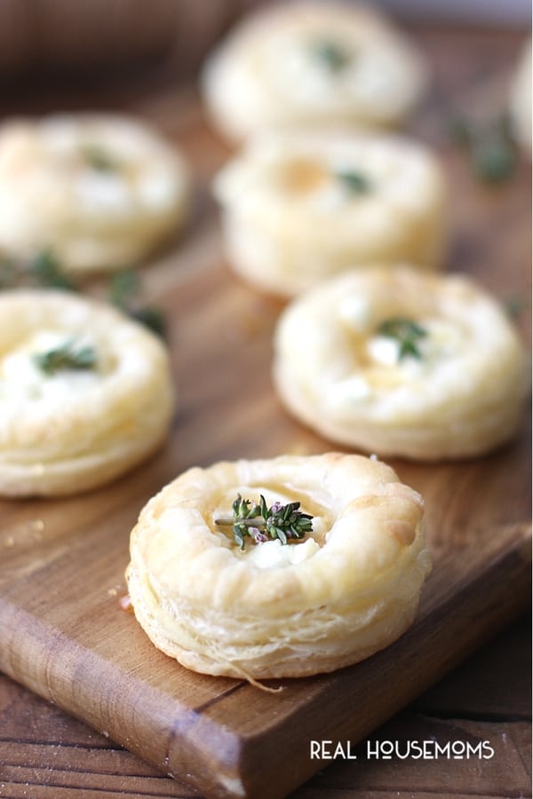 Bakes Goat Cheese and Honey Bites topped with a sprig of thyme