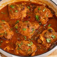 square image of golden chicken in a large skillet