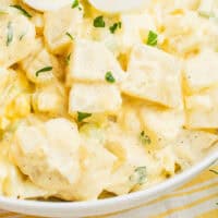 grandma's best potato salad recipe in a serving bowl with recipe name at the bottom
