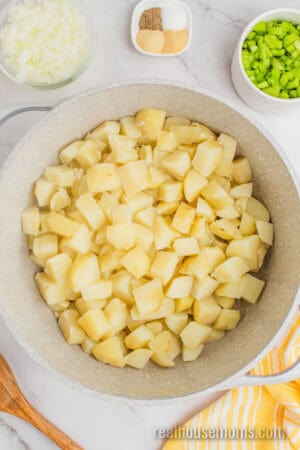 cooked russet potatoes in a large pot after being drained