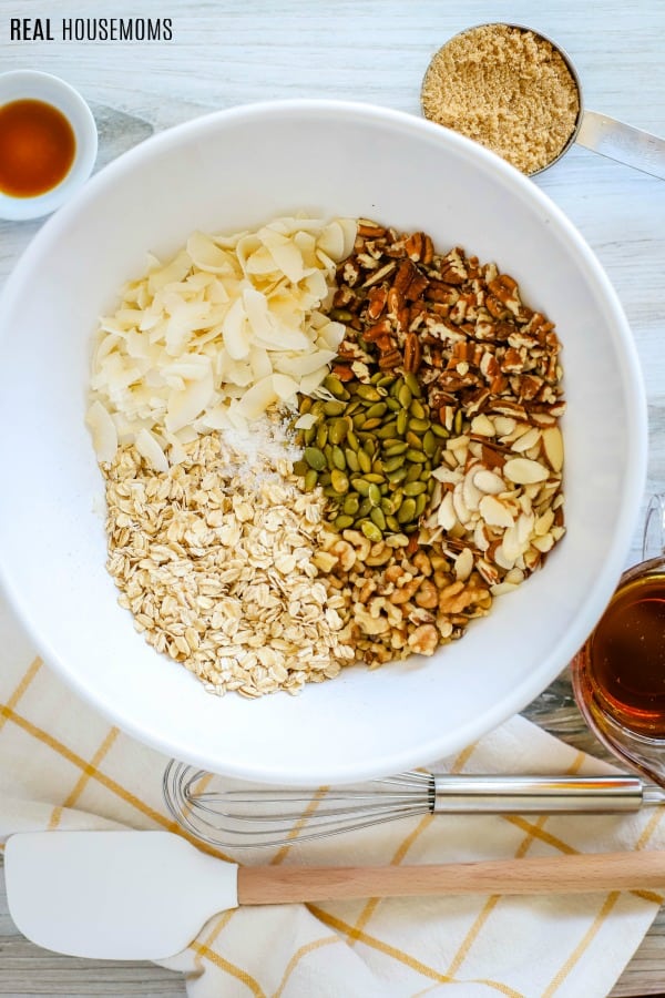 ingredients for homemade granola recipe in a mixing bowl