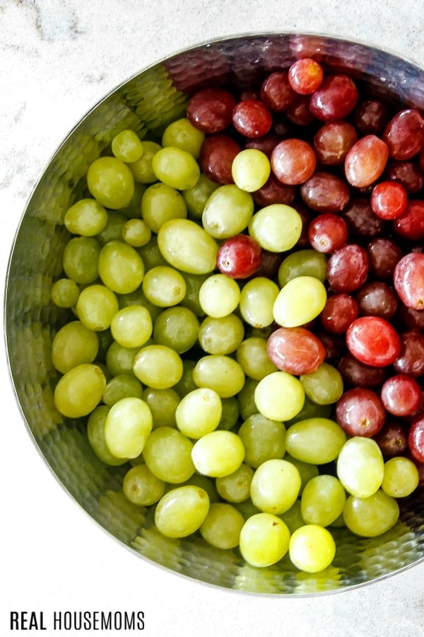 Red and green grapes in a mixing bowl
