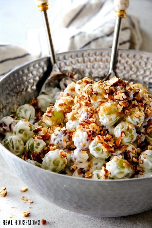 grape salad topped with chopped pecans and brown sugar