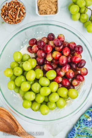 washed a dried grapes added to a bowl with grape salad dressing