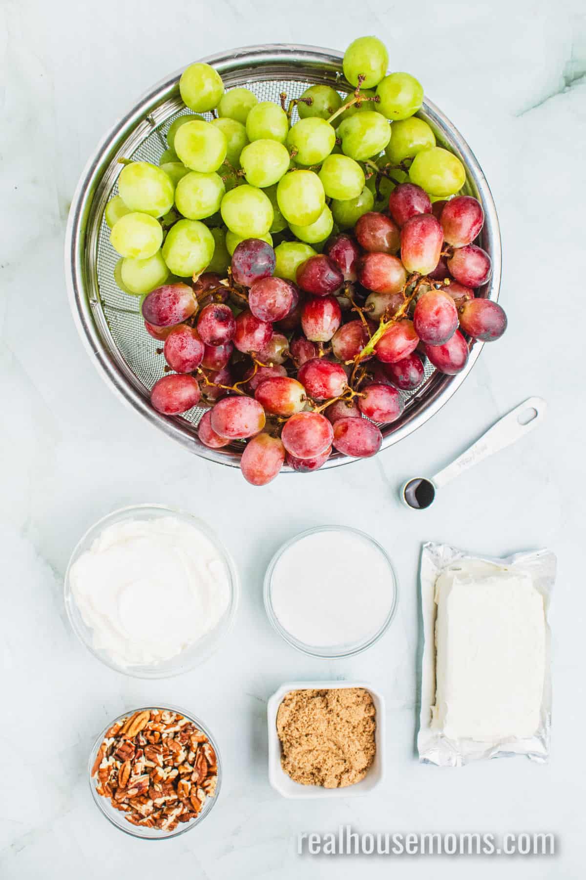 ingredients to make creamy grape salad laid out on a counter