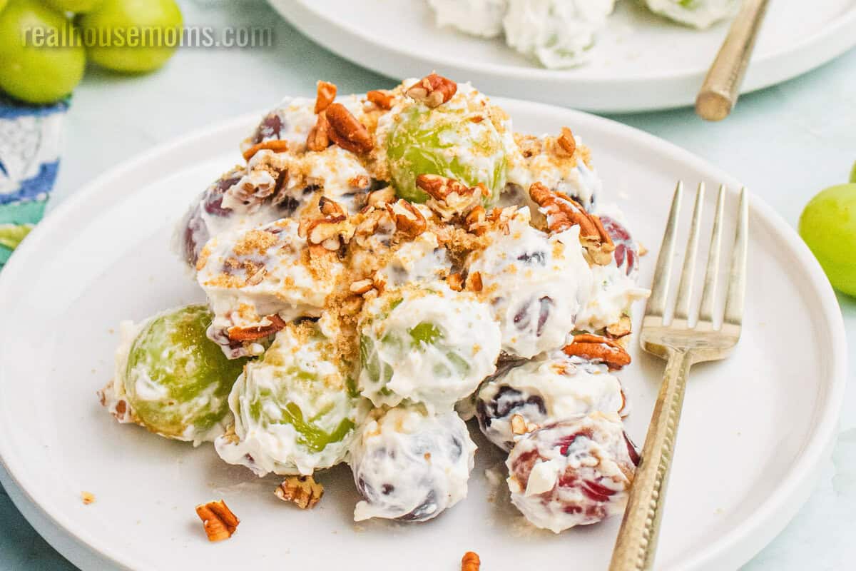 portion of grape salad on a small with plate with a fork