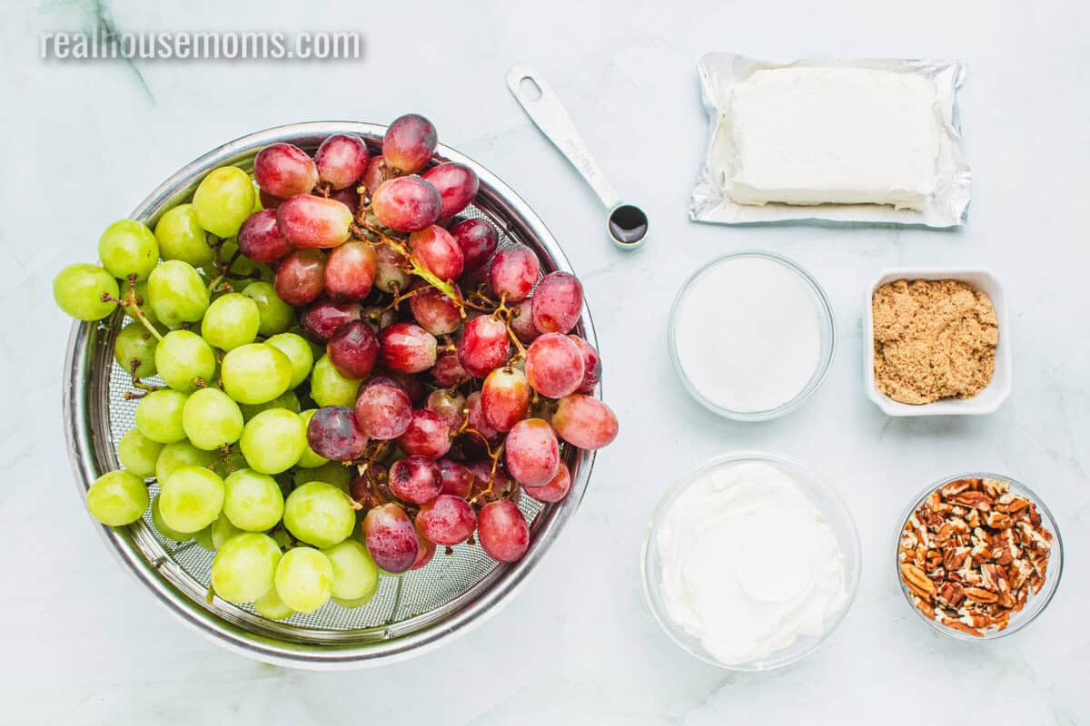 ingredients to make grape salad laid out on a counter