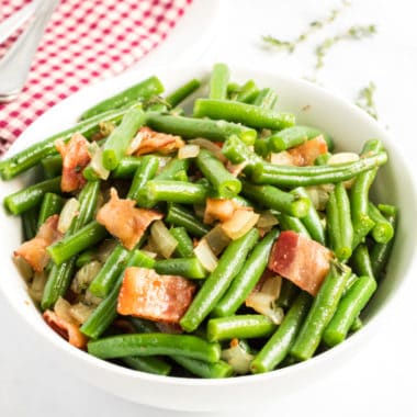 Crispy bacon and sautéed onions pair perfectly with fresh green beans. Even your kids will be asking for seconds of their vegetables when you serve Green Beans with Bacon!