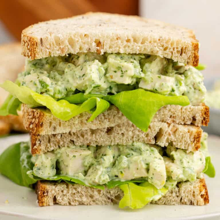 square image of a green goddess chicken salad cut in half with the halves stacked