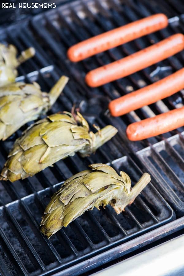 Grilled Artichokes with Honey Sriracha Dipping Sauce make summer grilling super easy and tasty! I love to serve them up with a simple dish like grilled hot dogs.