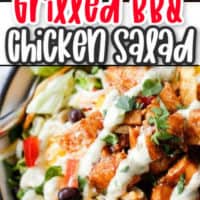 grilled chicken on top of a salad
