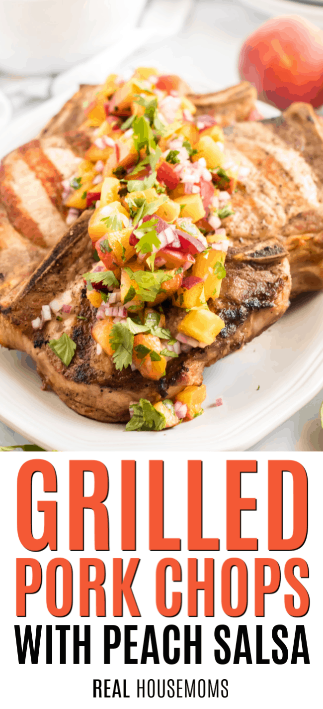 grilled pork chops on a platter with peach salsa