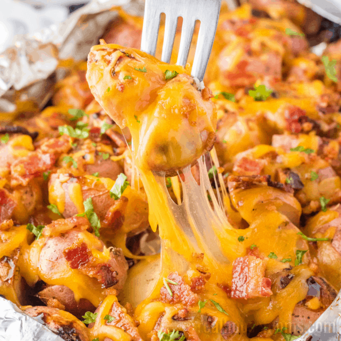 Grilled Ranch Potatoes are a simple side dish perfect for summer dinners. Just toss them on the grill and load them up with your favorite toppings!