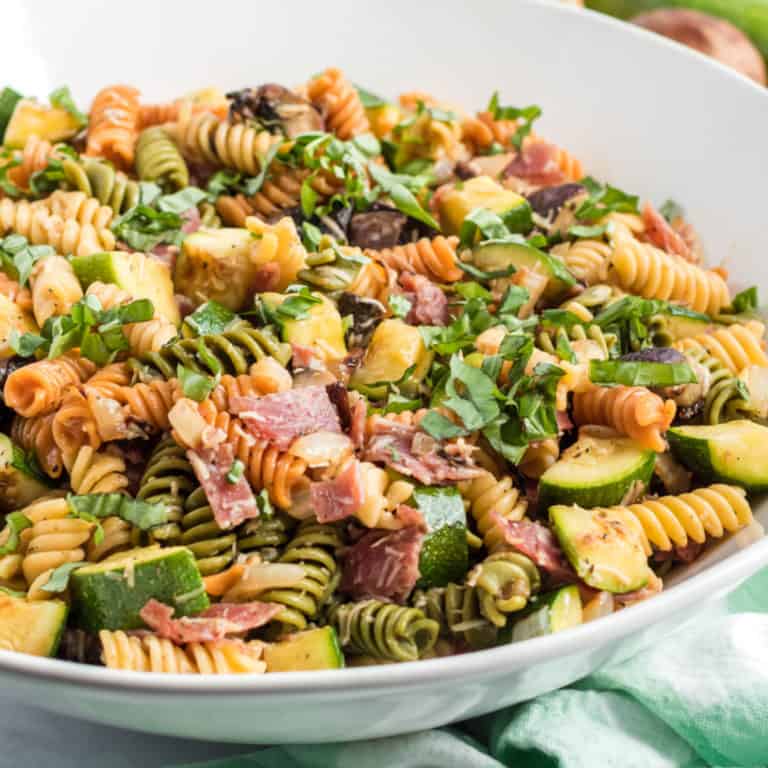 square image of grilled vegetable pasta salad in a serving bowl