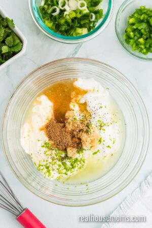 coleslaw dressing ingredients in a glass mixing bowl