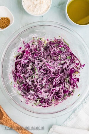 cilantro lime coleslaw in a glass mixing bowl