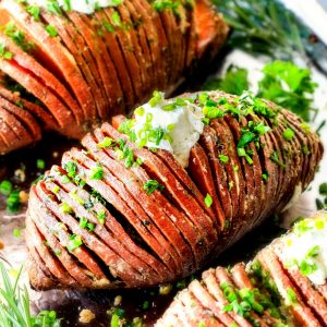 These Hasselback Sweet Potatoes are tender, melt-in-your-mouth and bursting with garlic herb, butter flavor! They look wonderfully gourmet for Thanksgiving and special occasions but are everyday easy!