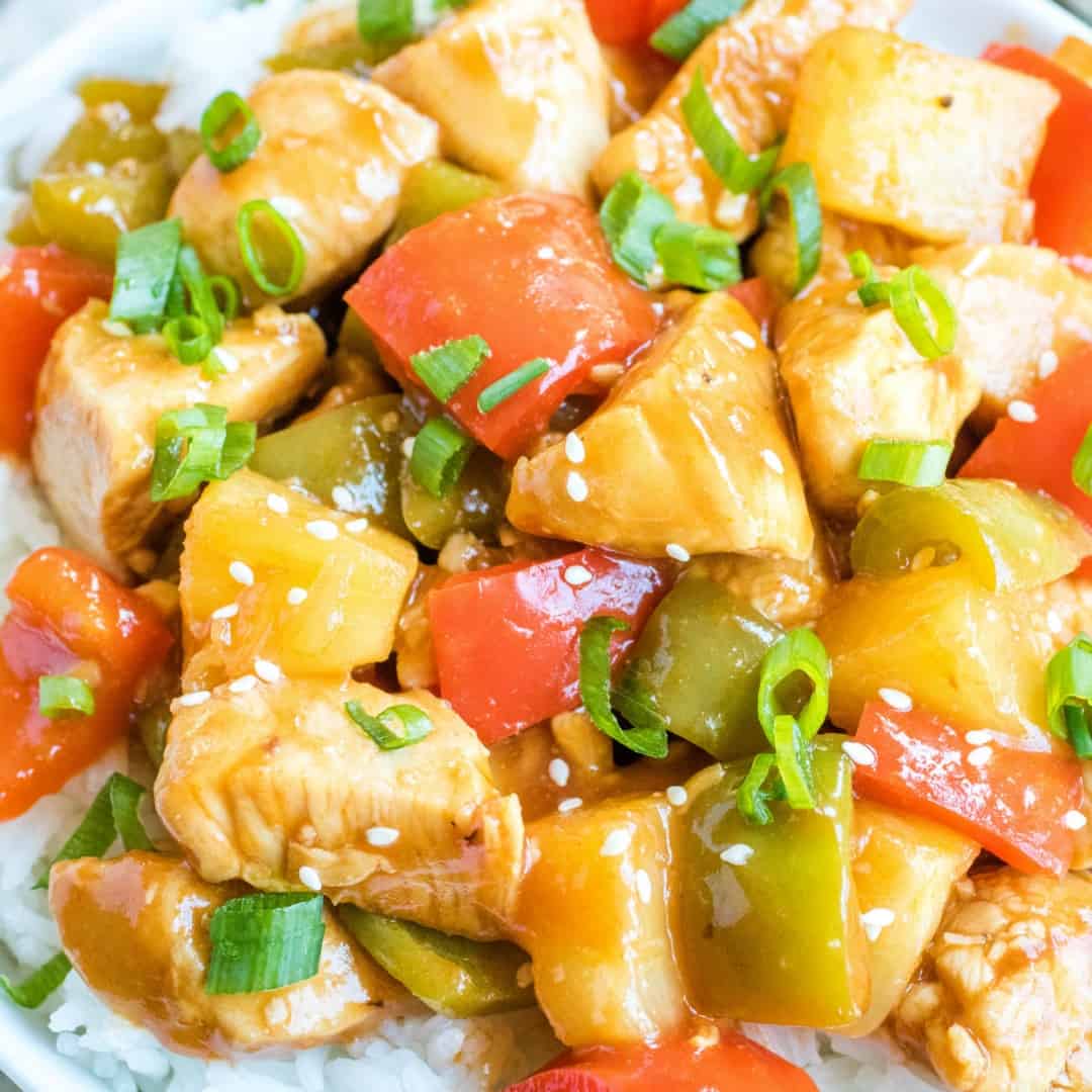 Hawaiian Chicken Bites are an easy dinner or appetizer recipe made with chicken, bell peppers, and pineapple tossed in a sweet, tangy sauce!