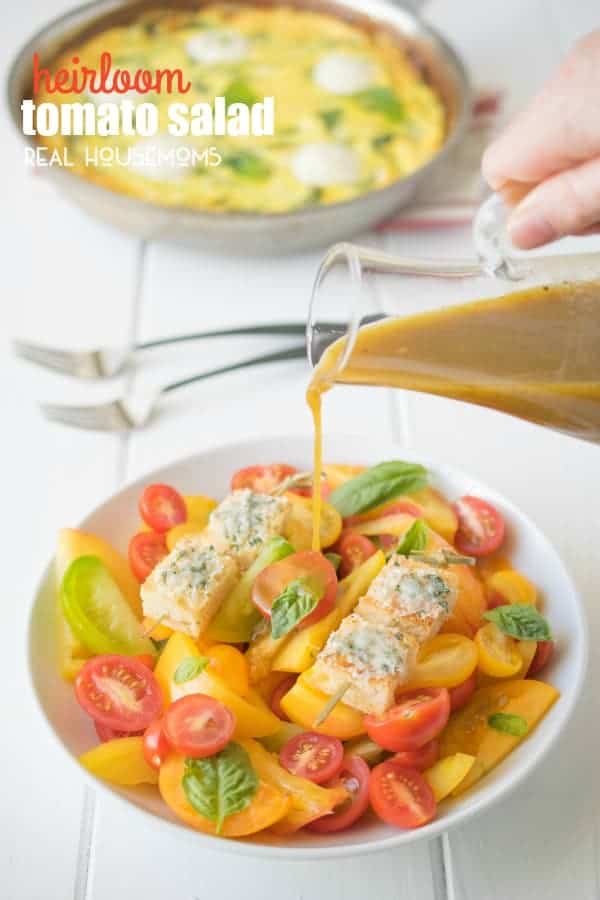 HEIRLOOM TOMATO SALAD is an easy and very colorful side dish served with fresh basil and crispy, cheesy croutons for a fresh summer bite you'll love!
