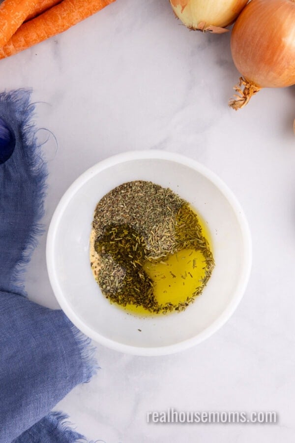 olive oil, dried herbs, garlic powder, salt, and pepper in a small bowl