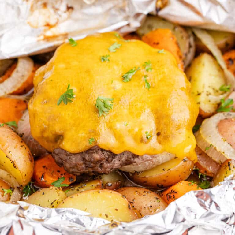 square image of hobo dinner recipe in the foil packet after cooking