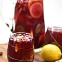 Holiday Sangria is a sweet wine cocktail loaded with fruit and juices that's a perfect drink for the holidays! Make it ahead of time to serve later!