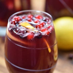 Holiday Sangria is a sweet wine cocktail loaded with fruit and juices that's a perfect drink for the holidays! Make it ahead of time to serve later!