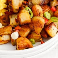 home fries on a plate with eggs and bacon with recipe name at the bottom