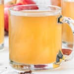 square image of homemade apple cider in a glass mug