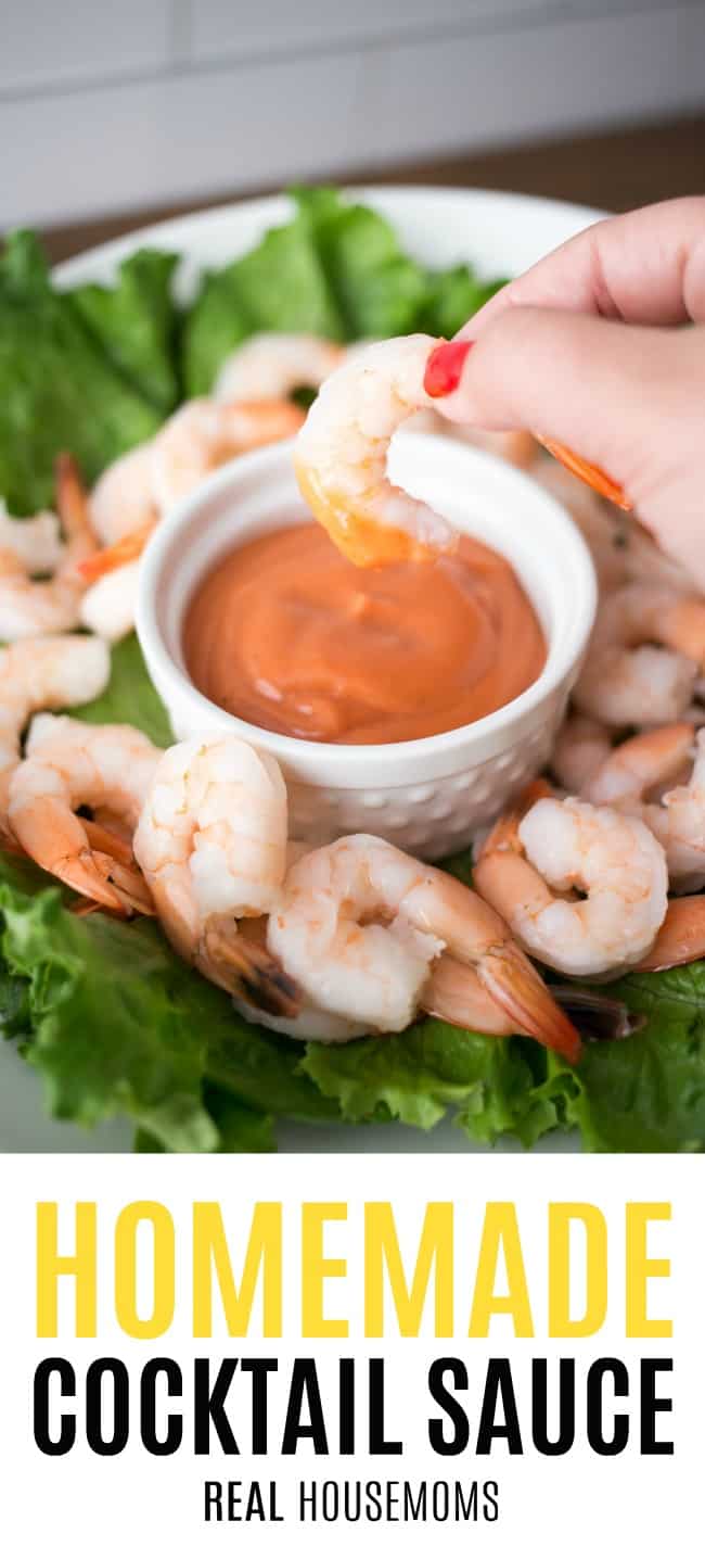 shrimp being dipped into homemade cocktail sauce