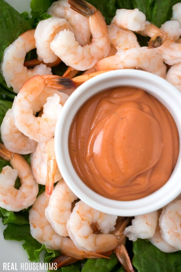cocktail sauce in a bowl surrounded by shrimp