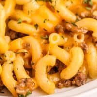 close up of homemade hamburger helper on a plate with recipe name at the bottom