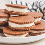 square image of homemade oreos piled on a plate