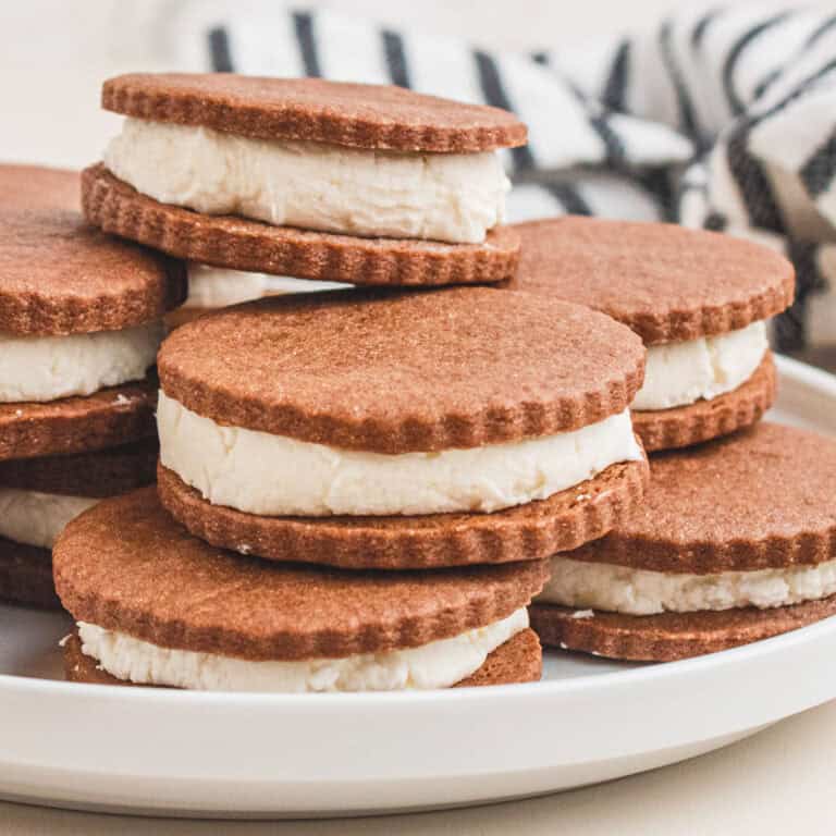 square image of homemade oreos piled on a plate