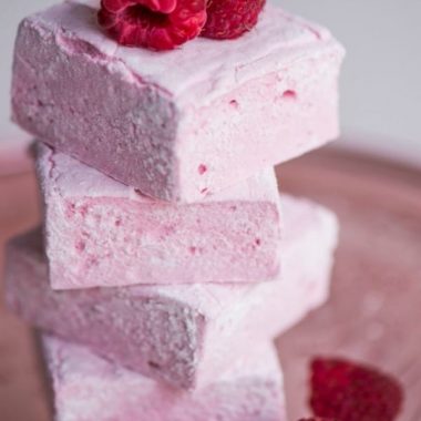 Homemade Raspberry Marshmallows, made with fresh raspberry puree, are surprisingly easy to make and are a fun summer dessert your family will love!