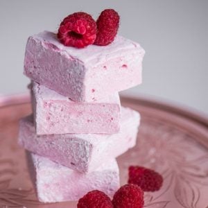 Homemade Raspberry Marshmallows, made with fresh raspberry puree, are surprisingly easy to make and are a fun summer dessert your family will love!