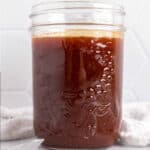 square image of honey barbecue sauce in mason jar