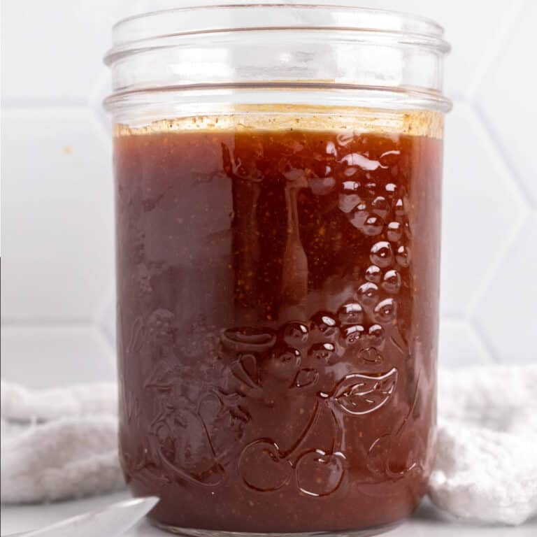 square image of honey barbecue sauce in mason jar