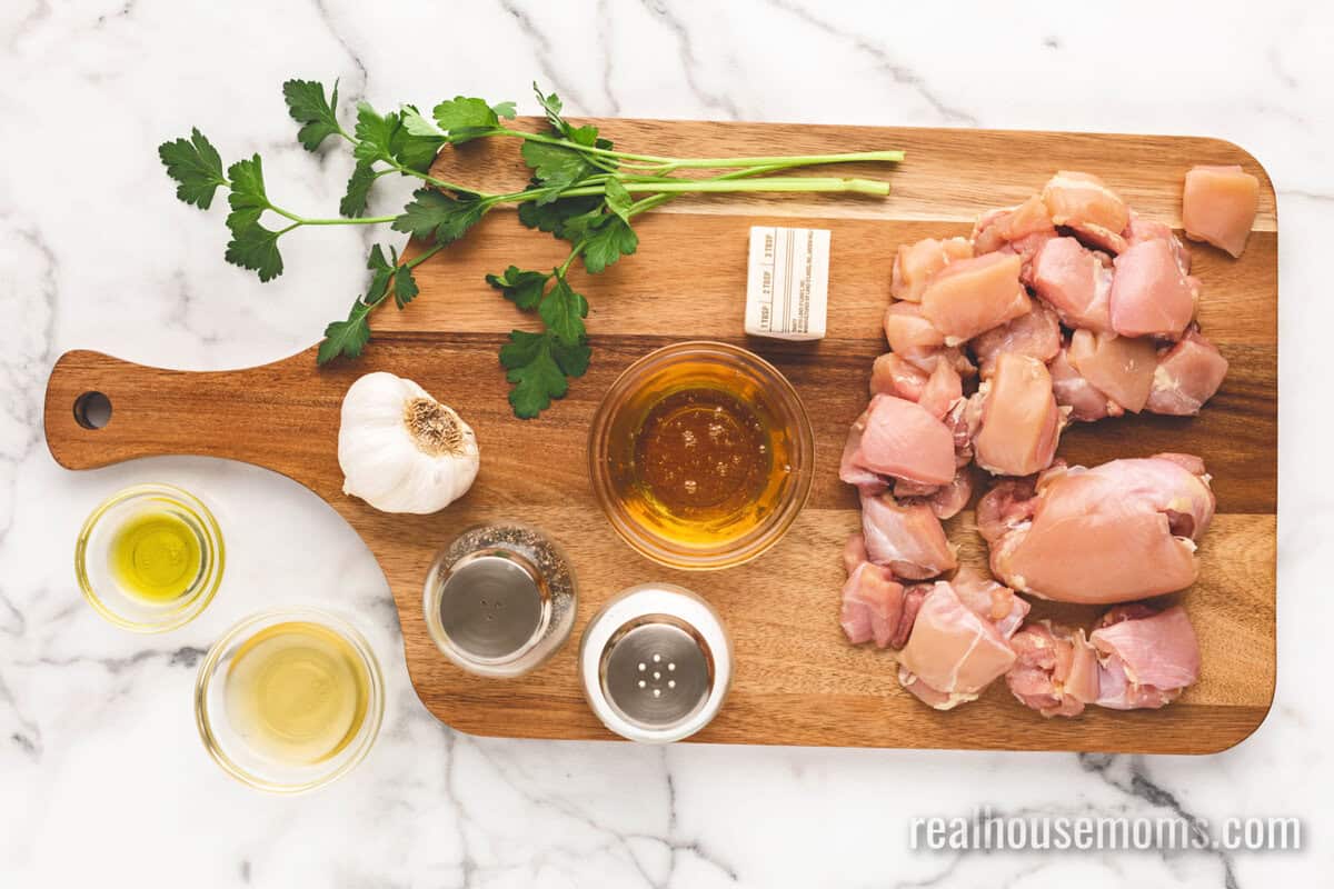ingredients to make honey butter chicken laid out on a cutting board