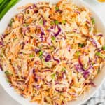 square image of honey sriracha coleslaw in a serving bowl