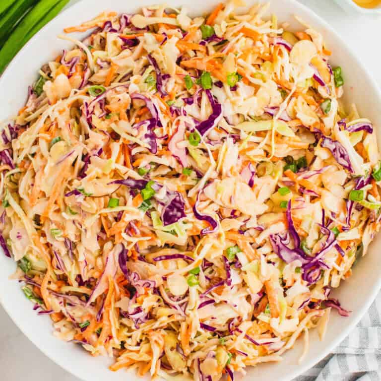 square image of honey sriracha coleslaw in a serving bowl
