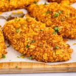 square image of hot honey cornflake chicken on a cutting board