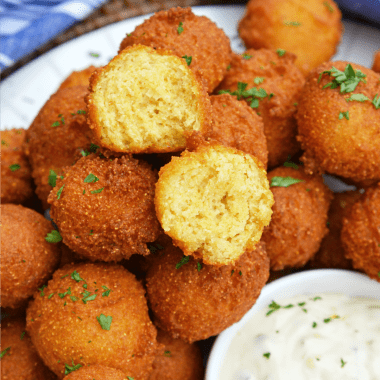 Hush Puppies are gently fried cornbread with a crunchy outside and soft, doughy inside. Serve with fish fry, fried shrimp or any BBQ!