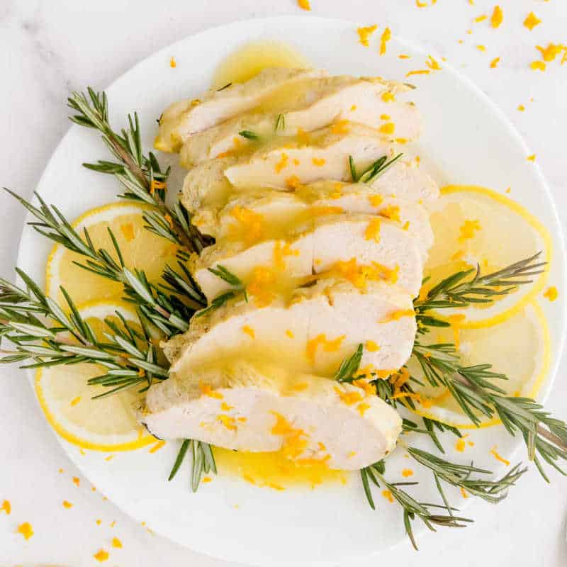 Featured image of white plate of Instant Pot Turkey Tenderloin with garnish