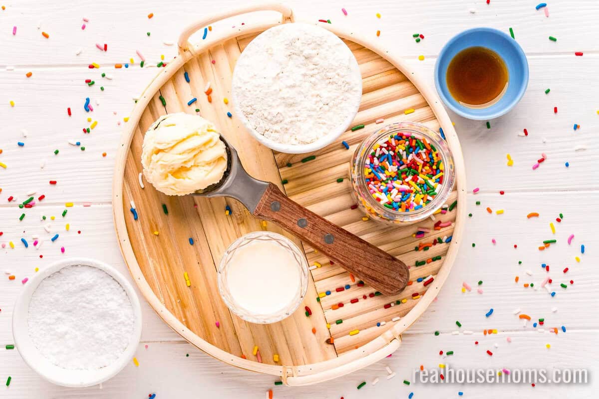 ingredients to make ice cream bread and glaze in bowls on a tray